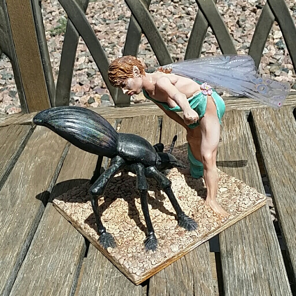 Hand sculpted Fairy and giant stink beetle